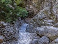 The trail narrows in the Imbros Gorge near Chania, Crete on a bright sunny day Royalty Free Stock Photo