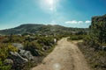 Trail passing through rocky terrain on highlands Royalty Free Stock Photo