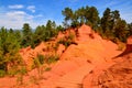 Trail through red ocher cliffs near Rousillon, Provence, France Royalty Free Stock Photo