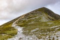 Trail, Rocks and vegetation at Croagh Patrick mountain with Westport in background Royalty Free Stock Photo