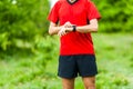 Trail runner looking at sport watch Royalty Free Stock Photo