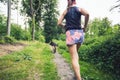 Trail running athletic woman in green forest, sports inspiration Royalty Free Stock Photo