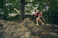 Trail running girl in green forest. Endurance sport. Royalty Free Stock Photo