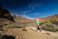 Trail running woman in mountains on sunny day Royalty Free Stock Photo