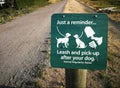 Trail sign: Leash and pick up after your dog Royalty Free Stock Photo