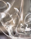 Trail of smoke on a dark background - creative colour effects with smoke smudges Royalty Free Stock Photo