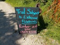 trail subject to flooding sign on trail or path