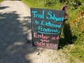 trail subject to flooding sign on trail or path Royalty Free Stock Photo