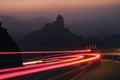 A trail of a vehicle night lights on the road to Tejeda Royalty Free Stock Photo