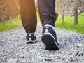 Trail walking Man legs with sport shoe Forest Park outdoor Royalty Free Stock Photo