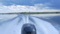 Trail on water surface behind of fast moving motor boat. the motor of motor boat, back view. Sea water ship trail with Royalty Free Stock Photo