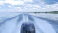 Trail on water surface behind of fast moving motor boat. the motor of motor boat, back view. Sea water ship trail with Royalty Free Stock Photo
