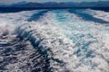 Trail on water surface or powerful stern wave behind of fast moving speedboat or ferry while cruising on ocean. Greek Aegean