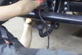 Trailer coupling.Installing a towbar on a passenger car.Cargo transportation by passenger car Royalty Free Stock Photo