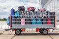 Trailer on airport filled with suitcases