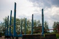 Trailer for removal of wood.Blue trailer against the sky,for the transportation of logs. Royalty Free Stock Photo