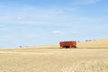 Trailer standing on a harvested field Royalty Free Stock Photo