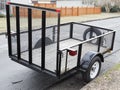 Trailer with wire mesh sides parked on residential neighborhood street