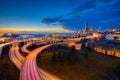 Trailing Car Lights and the Seattle Skyline at Sunset Royalty Free Stock Photo