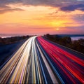 Trails  of cars lights on the asphalt road. Sunset sundown time. Drive forward! Transport creative background. Long exposure, Royalty Free Stock Photo