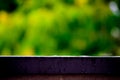 Trails of falling raindrops on the edge of a fence with a long exposure, abstract background