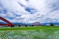 A train across a m-type Red Bridge on the lush paddy fields, is Taiwan sight in East on August 14 2018 in Hualien, Taiwan