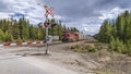 A Train Approaches a Level Crossing in Banff Royalty Free Stock Photo