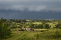 Train and approaching thunderstorm Royalty Free Stock Photo