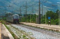 Train arrives at regular rural train station Royalty Free Stock Photo