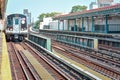 Train arriving at the station in New York City. Buildings in the background, cityscape. Travel and transit concept. Manhattan, NYC Royalty Free Stock Photo