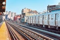 Train arriving at the station in New York City. Buildings in the background, cityscape. Travel and transit concept. Manhattan, NYC Royalty Free Stock Photo