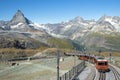 Train on the background of the Swiss Alps and the top of the Matterhorn