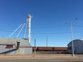 Train Behind a Grain Distributor Building Royalty Free Stock Photo