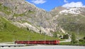 Train at Bernina Diavolezza station on the Bernina Railway line. Royalty Free Stock Photo