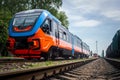 The train is black with orange color at the railway station before departure.