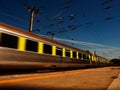 Train on blur mouvement in bright day Royalty Free Stock Photo