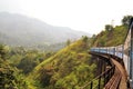 Train on bridge in hill country of Sri Lanka Royalty Free Stock Photo