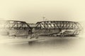 Train on a bridge over river. with image vintage tone