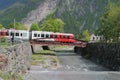 Train, bridge and river Trient. Vernayaz, Martigny, Switzerland Royalty Free Stock Photo