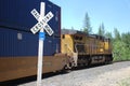 Train and caboose and railroad crossing