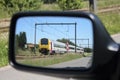 Train in car mirror Royalty Free Stock Photo