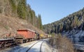 Train. Mountains. Rusty. Snow. Winter. Forest Royalty Free Stock Photo
