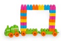 Train of colorful childrens building bricks with frame