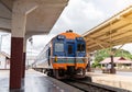 The train come to railway station platform