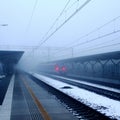 Train coming down the tracks in a foggy area Royalty Free Stock Photo