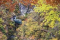 Train coming out of a tunnel onto the bridge over Naruko Gorge w Royalty Free Stock Photo