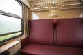 Train compartment with red seats with the view Royalty Free Stock Photo