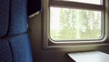 Train window, nature outside the window, camera movement