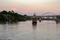 A train crossing a bridge over a body of water Royalty Free Stock Photo