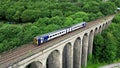 Train crossing Lockwood Viaduct in Huddersfield, England